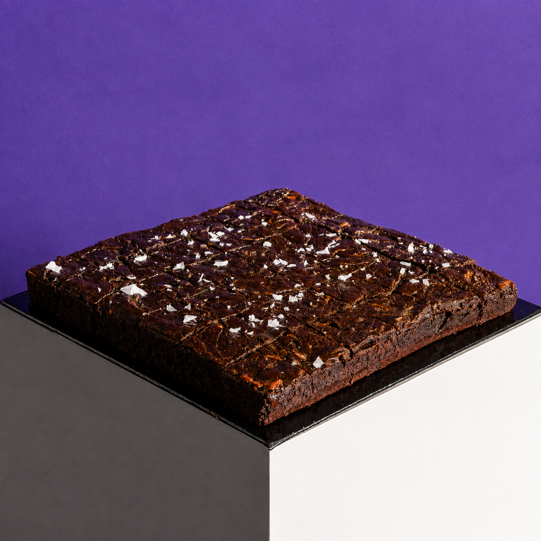 Sourdough salted caramel brownie, a 9-inch square slab topped with caramel swirl and flaky sea salt