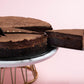 Serving a slice of Nutella Fudge Cake by Elevete Patisserie