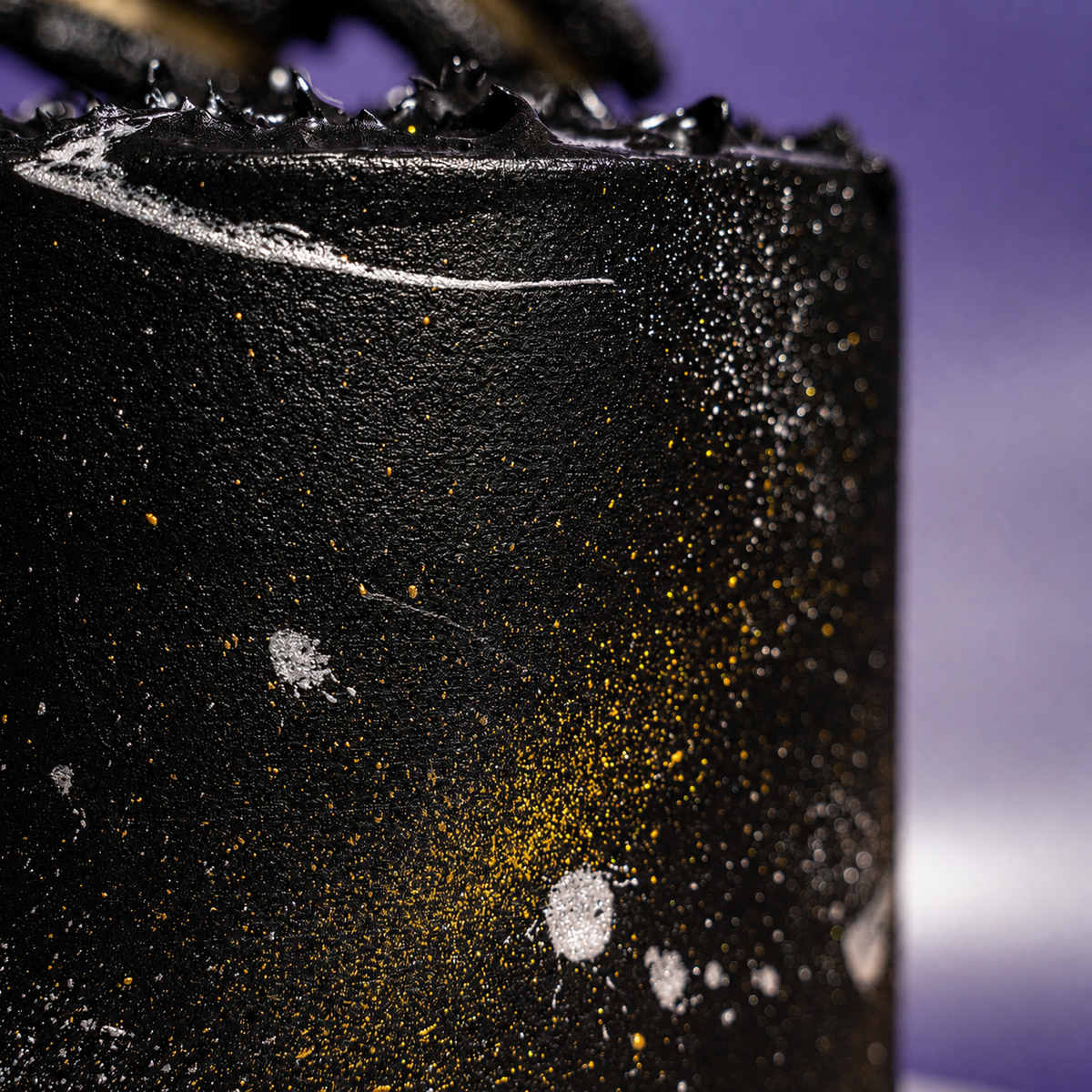 Side view of the 5-inch Midnight Gold designer cake on a black cake board
