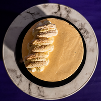 Top-down view of the 5-inch Twilight Ombré designer cake and its macarons