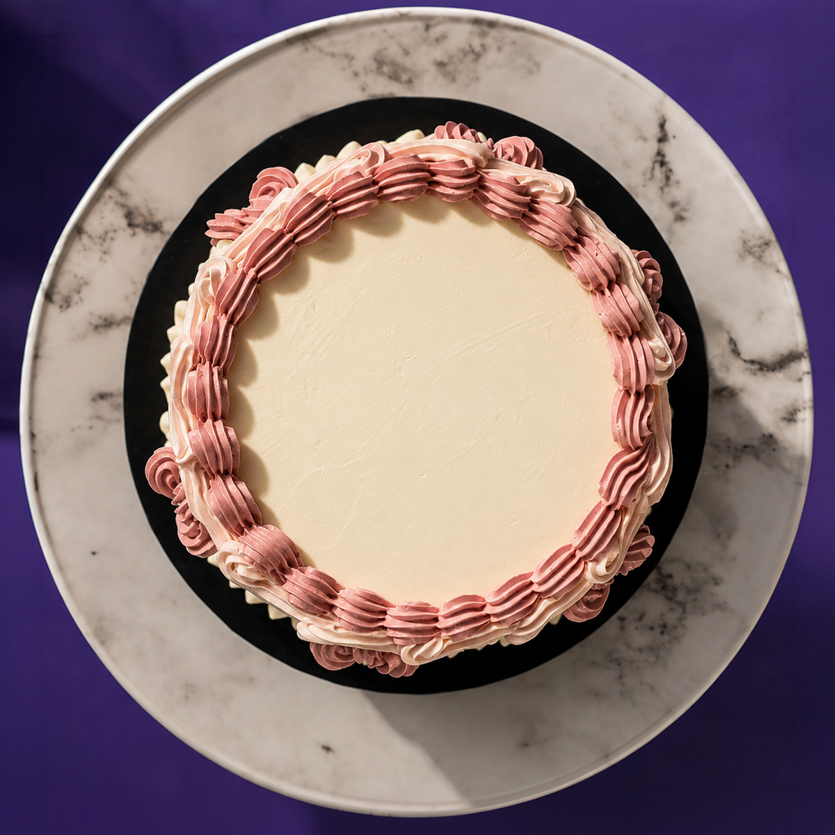 Top-down view of the Vintage Bloom cake in rose, showing the clear top for a message or candle