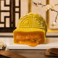 Pandan gula melaka snowskin mooncake cut open showing the palm sugar centre