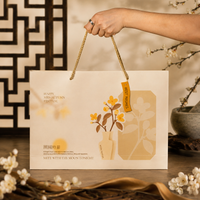 Hands holding the Elevete mooncake gift box, ready for Mid-Autumn gifting