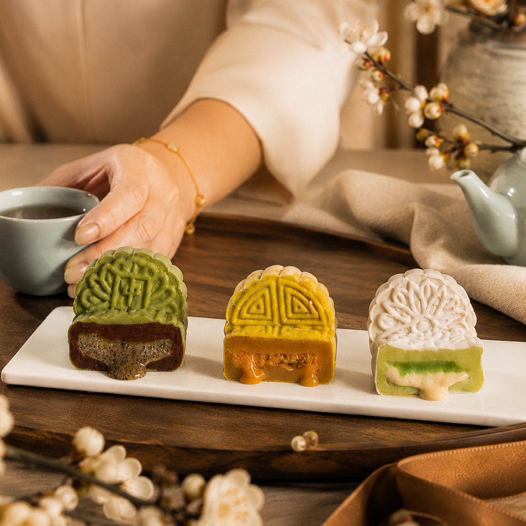 Snowskin mooncake gift box on a table set for a Mid-Autumn family reunion