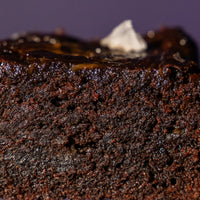 Close-up of the dense fudgy crumb inside an Elevete sourdough salted caramel brownie