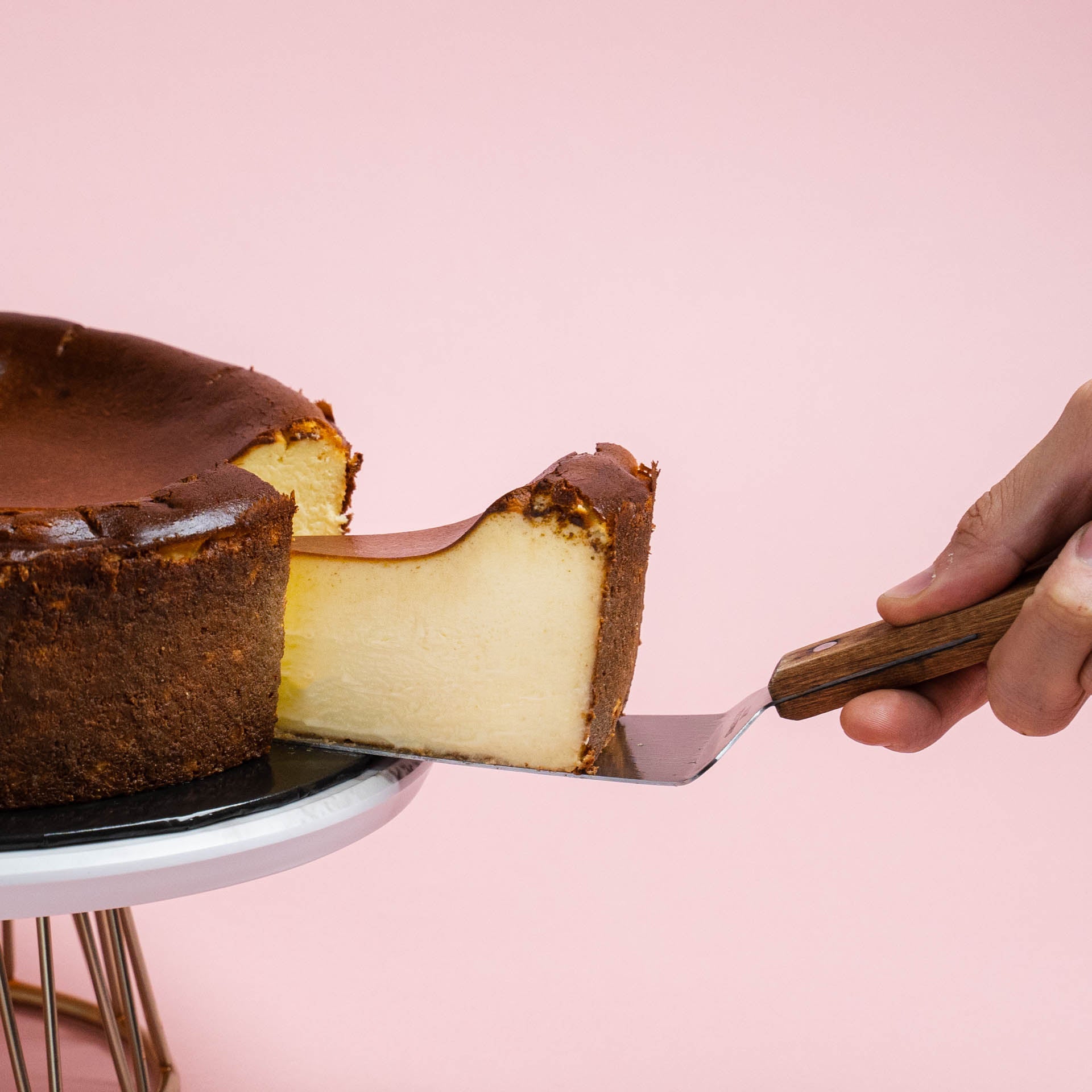 Serving a Slice of Burnt Cheesecake Original Flavour by Elevete Patisserie