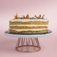 Side View of Lemon Poppyseed cake decorated with poppyseed, dehydrated lemon & rose petals on top by Elevete Patisserie