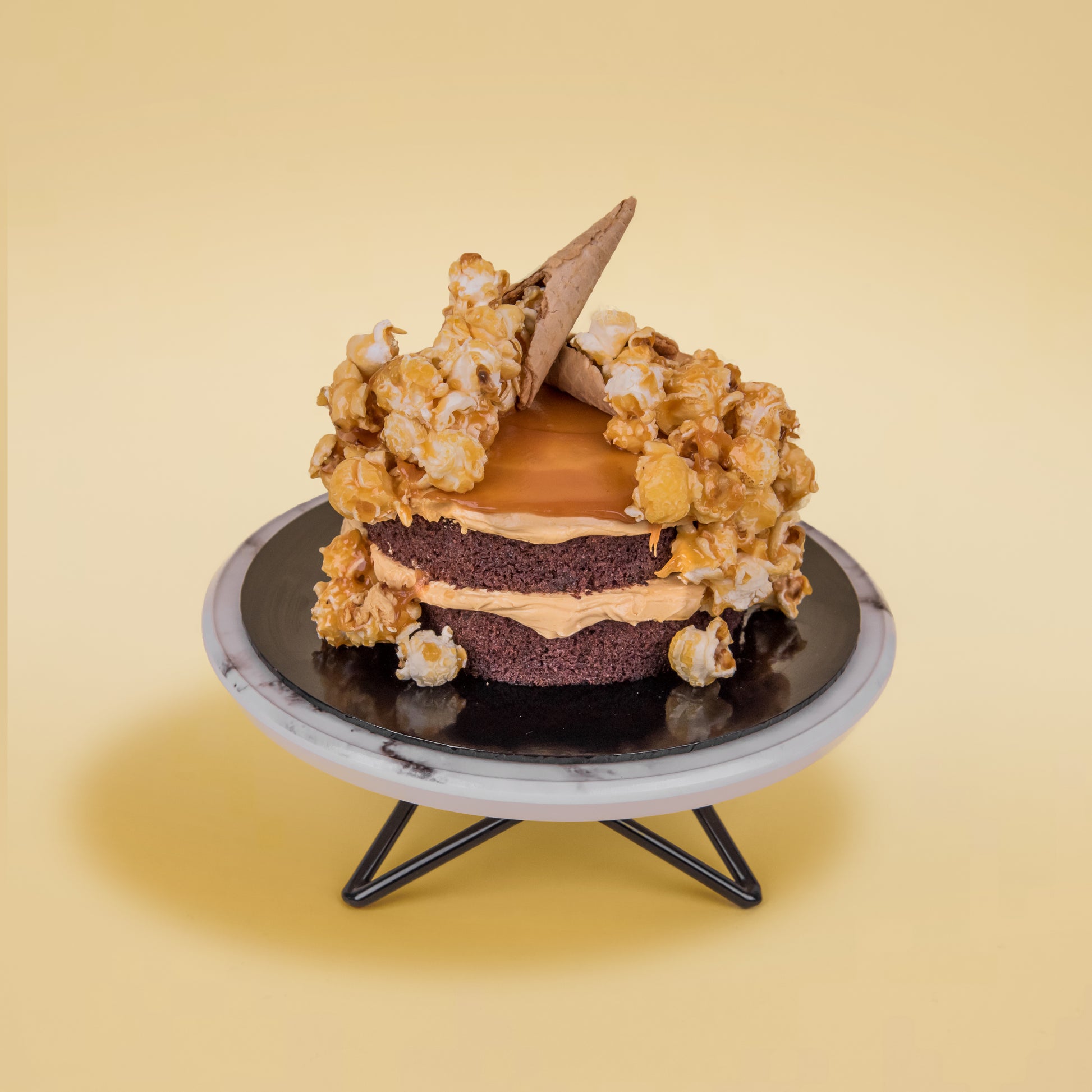 Top View of Salted Caramel Chocolate Cake with Popcorns on Top (Mini Popstar Cake by Elevete Patisserie)