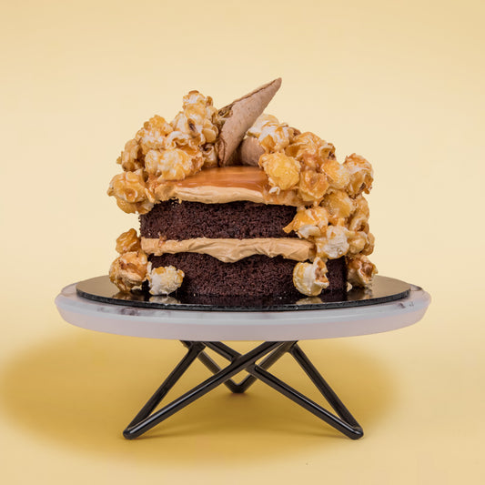 Side View of Salted Caramel Chocolate Cake with Popcorns on Top (Mini Popstar Cake by Elevete Patisserie)