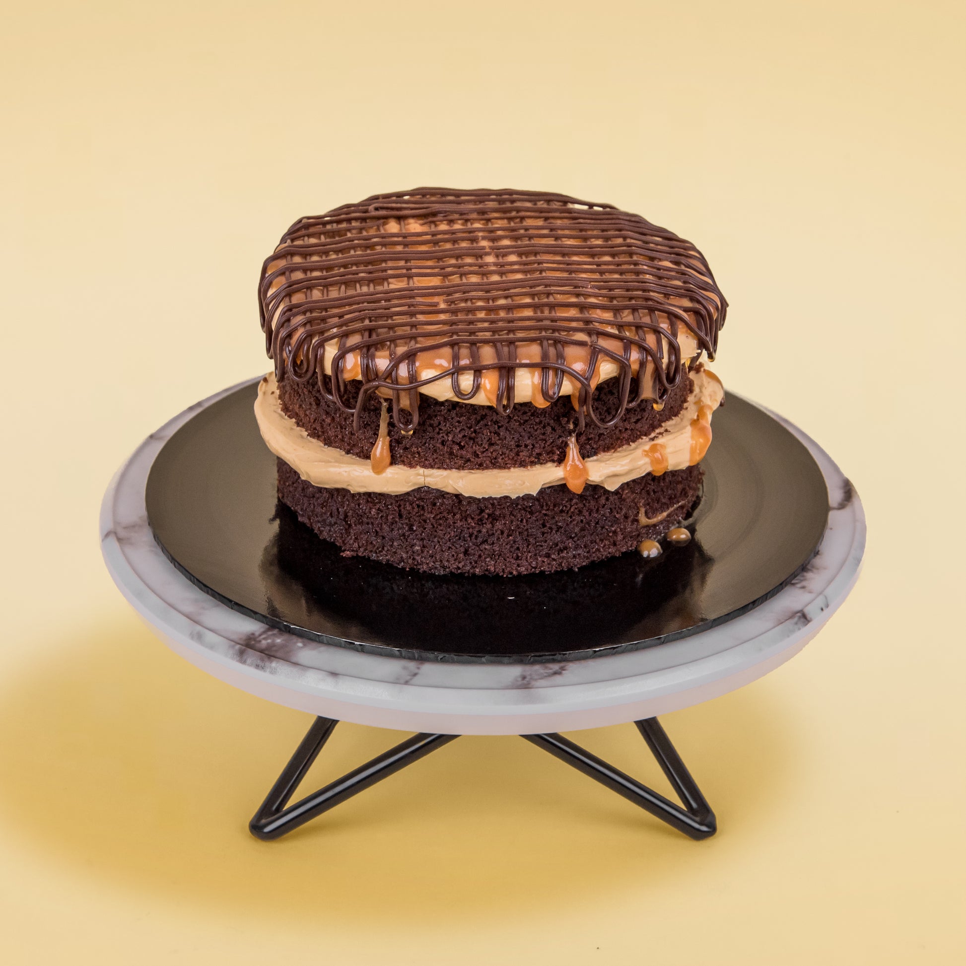 Top view of Mini Salted Caramel Chocolate Cake with Chocolate & Salted Caramel Drizzle On Top by Elevete Patisserie