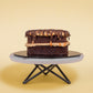 Side View of Mini Salted Caramel Chocolate Cake with Chocolate & Salted Caramel Drizzle On Top by Elevete Patisserie