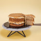 Serving a slice of Mini Butterscotch Cookies Cake Chocolate Chip Cookie Crumbles by Elevete Patisserie
