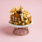 30 degrees angle view of Popstar 7 Inch Salted Caramel Chocolate Cake - A Signature Cake by Elevete Patisserie