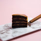 Serving size for 1 Slice of Popstar 7 Inch Salted Caramel Chocolate Cake - A Signature Cake by Elevete Patisserie