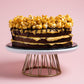 Side View of Salted Caramel Chocolate 9 Inch Cake with Popcorns on Top by Elevete Patisserie