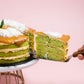 Serving a Slice of The Locale Pandan Gula Melaka Cake by Elevete Patisserie